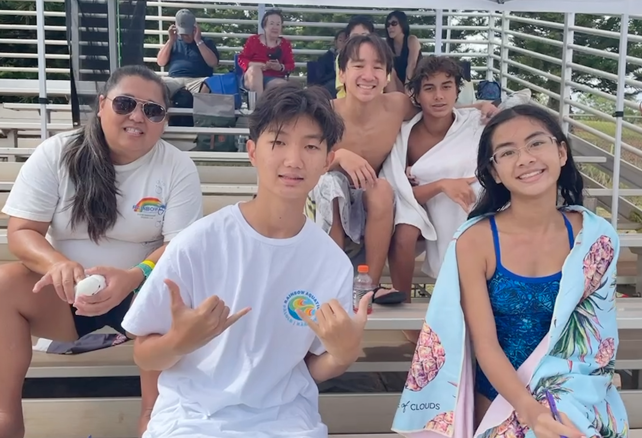 photo of swimmers and coach