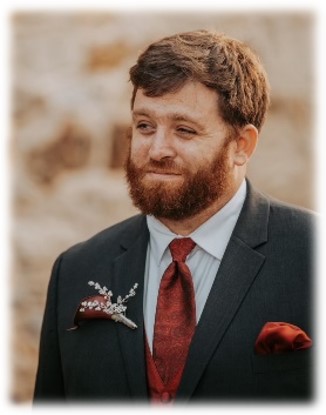 A person in a suitDescription automatically generated